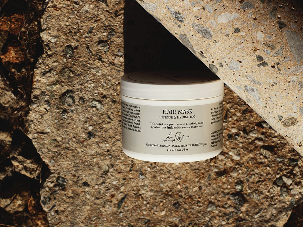 Harklinikken Hydrating Hair Mask within Nature resting on a rocky surface